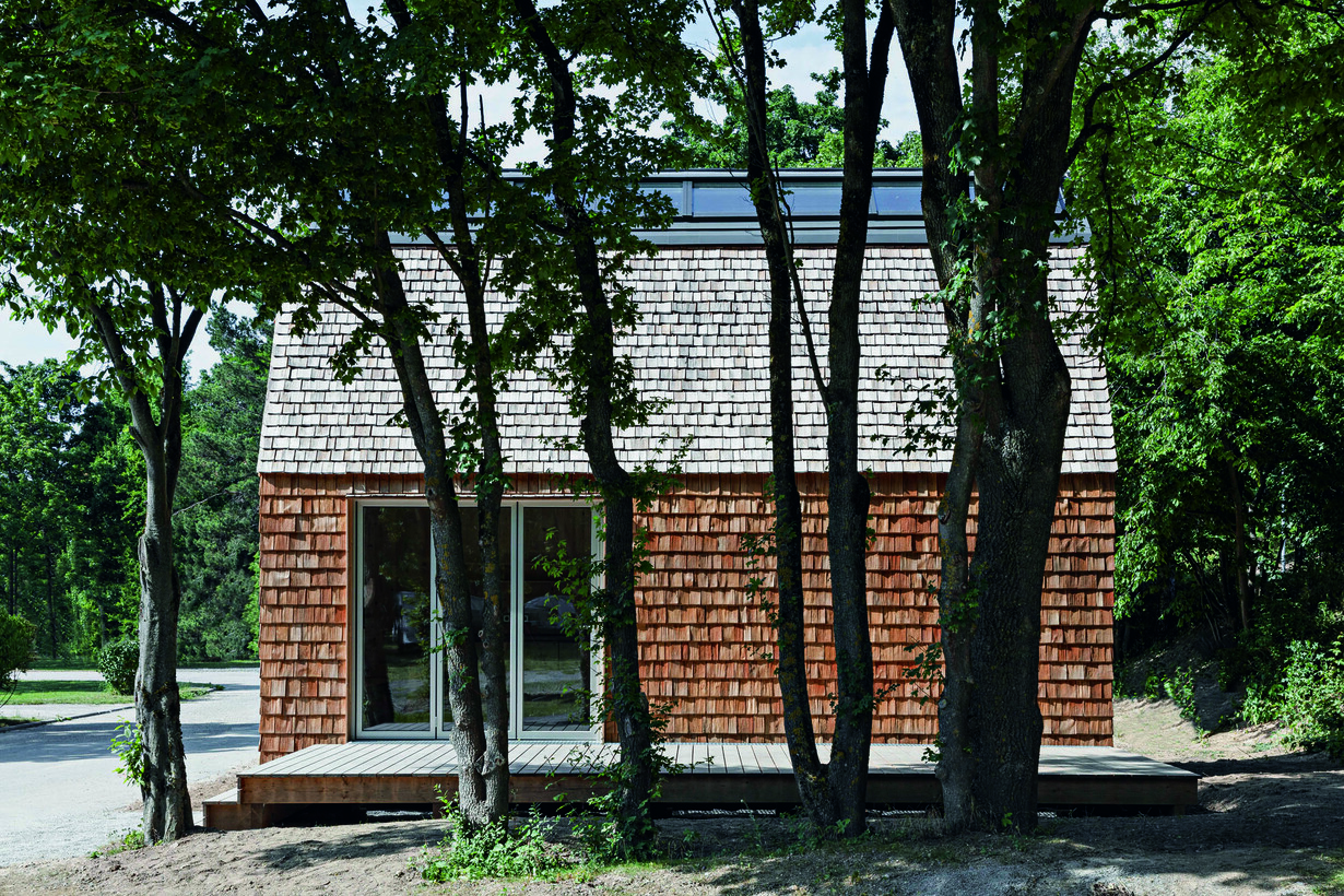  image of a house behind trees