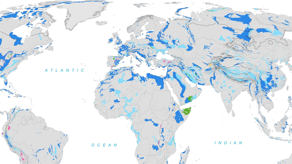 Weltkarte mit blauen Markierungen der Karstgebiete