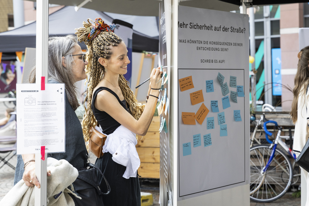 A woman writing something on a piece of paper