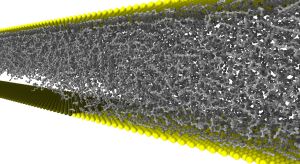 Eine Kavitationsblase entsteht im Schmiermittel zwischen Öl-anziehender (gelb) und Öl-abstoßender Fläche (schwarz). Als Puffer könnte sie Verschleiß reduzieren.(Bild: KIT)