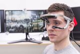 man with an eye tracking system on his head