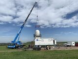 KITcube mobile measurement facility: with the help of a truck crane, the precipitation radar is installed at Müglitztal/Saxony. (Photo: Dr. Andreas Wieser, KIT)