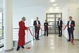 Sabine Brünger-Weilandt (FIZ Karlsruhe), Professor Holger Hanselka (President of KIT), Eva Lübke (NFDI), Professor York Sure-Vetter (KIT, NFDI), and Dr. Frank Mentrup (Mayor of Karlsruhe) cut the red ribbon to open the NFDI Directorate in Karlsruhe. (Phot